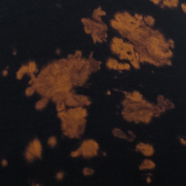 black with gold tie dye pattern swatch
