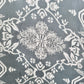 Gray with white snowflake pattern swatch