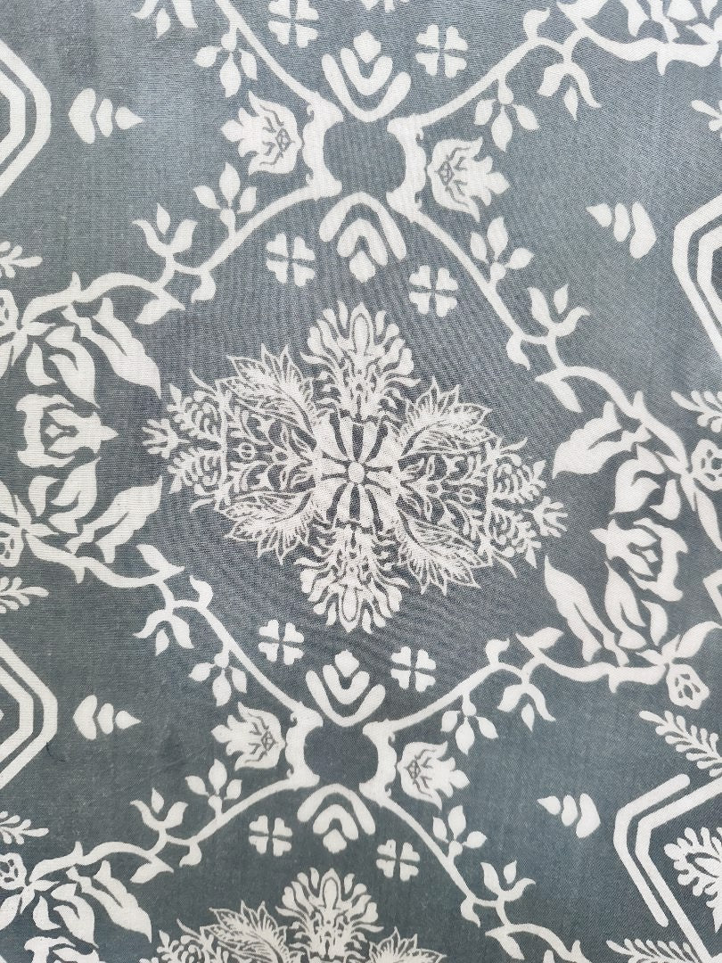 Gray with white snowflake pattern swatch