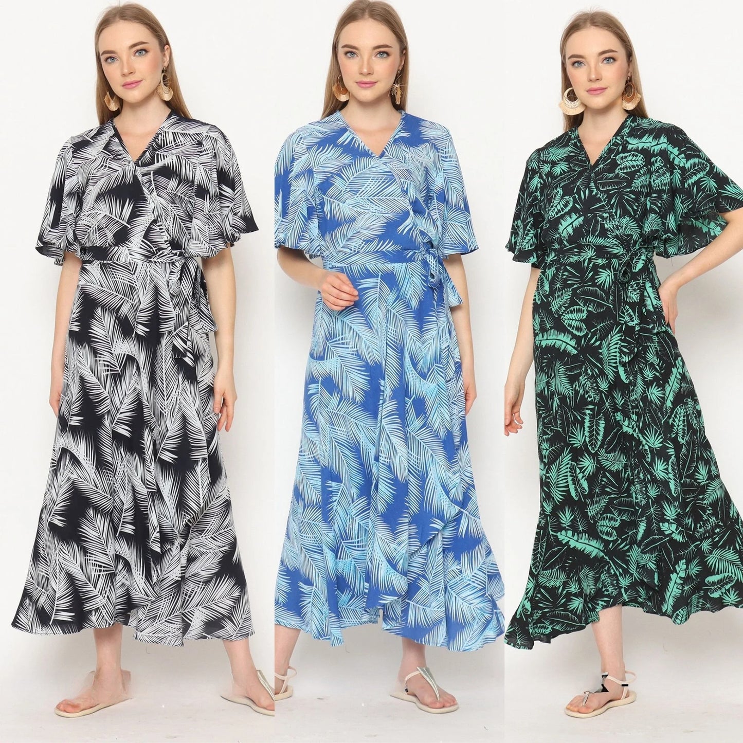 Three women wearing ankle-length wrap dresses with white leaf patterns. The dresses, in black, blue, and green shades, feature a flowy design with short sleeves. Each woman stands with a relaxed pose and neutral expression, perfectly showcasing these stylish wrap dresses for women.